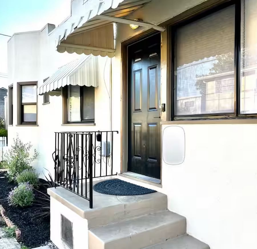 Front door has a smart lock, security mailbox for packages, and ring doorbell.
