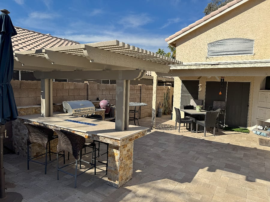 Outdoor BBQ, smoker and table for enjoyment outdoors.