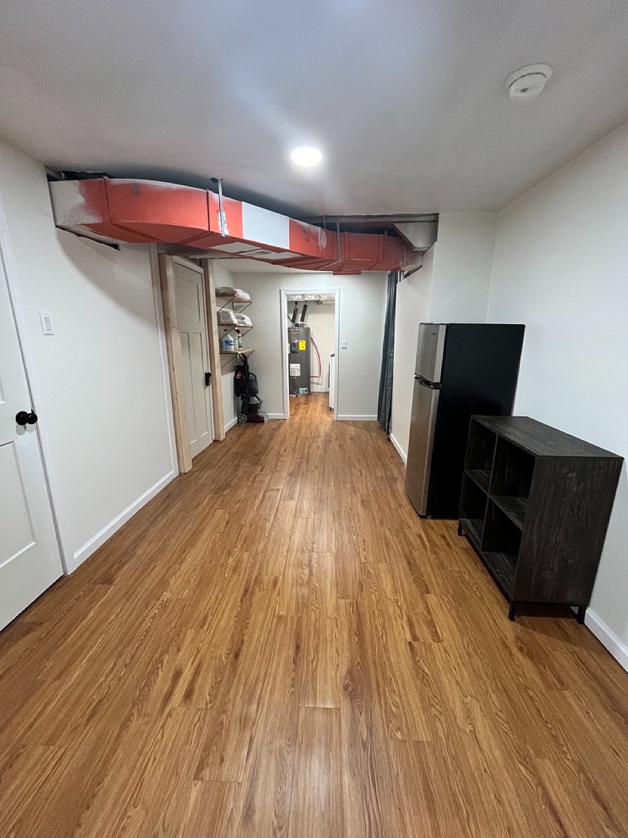 Basement with laundry, gym, and extra storage space