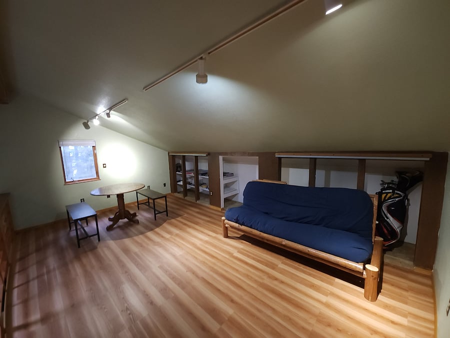 Loft gaming area with futon