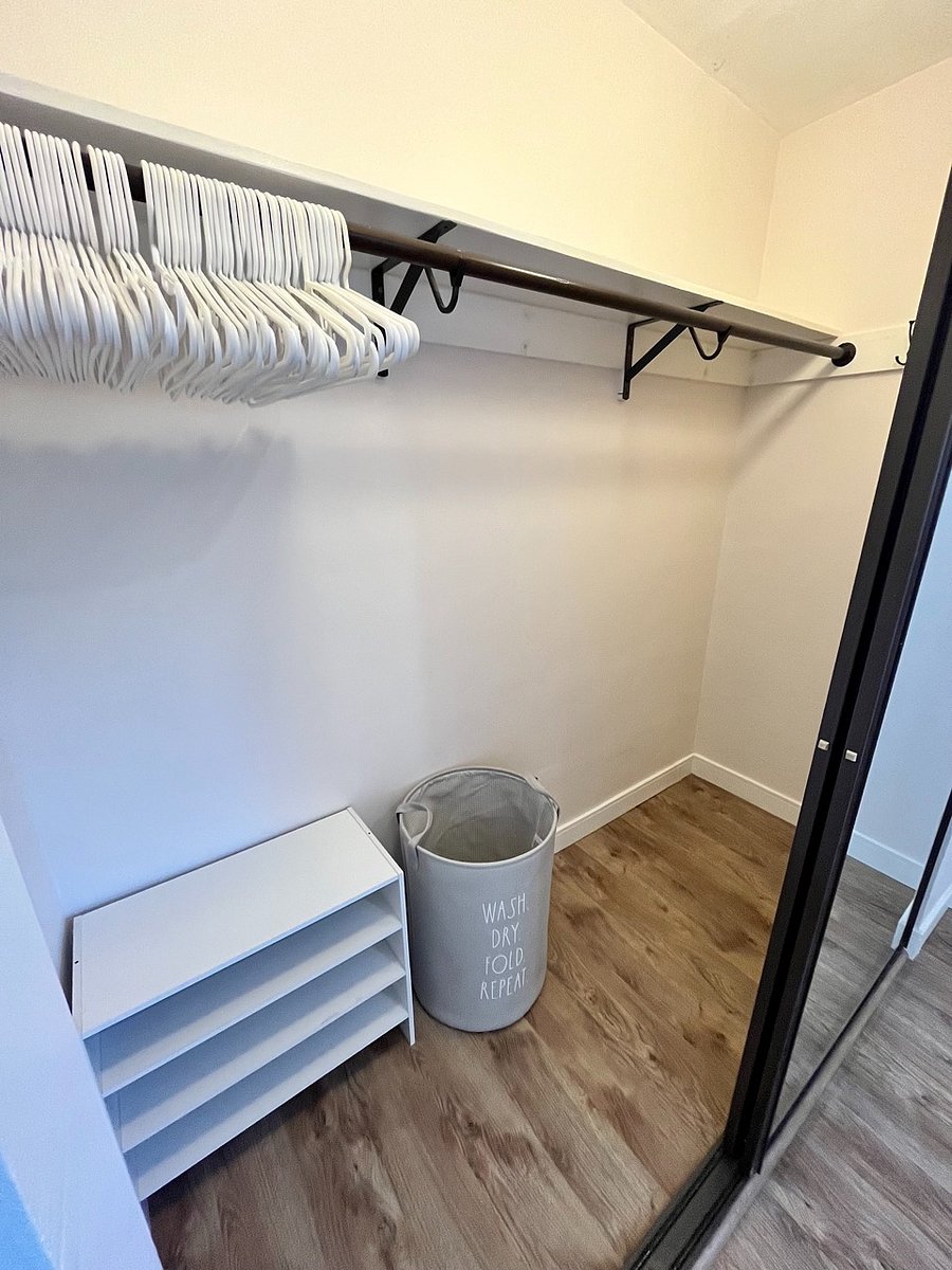 Bedroom closet 90.5w x 33d x 98h with interior light.
Hangers, hooks, shoe storage,  shelf storage and  laundry basket.

