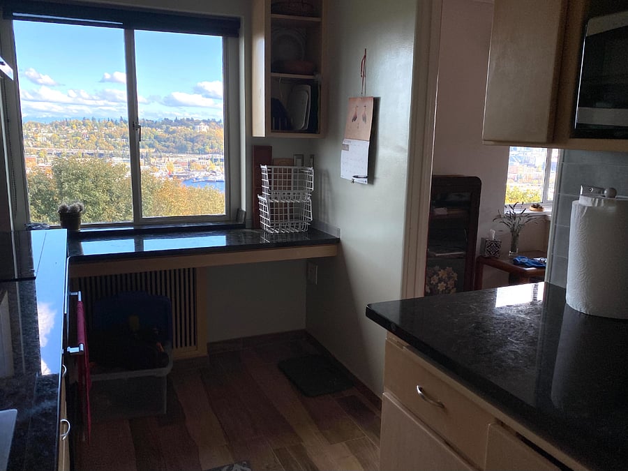 Kitchen E view, breakfast nook, cooking and baking utensils, Magic Bullet for your smoothy in the morning.