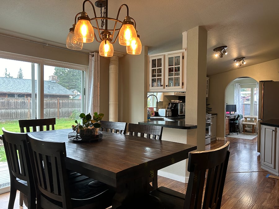 shared dining room, with view into kitchen (countertops have been redone and are now a shimmering white)