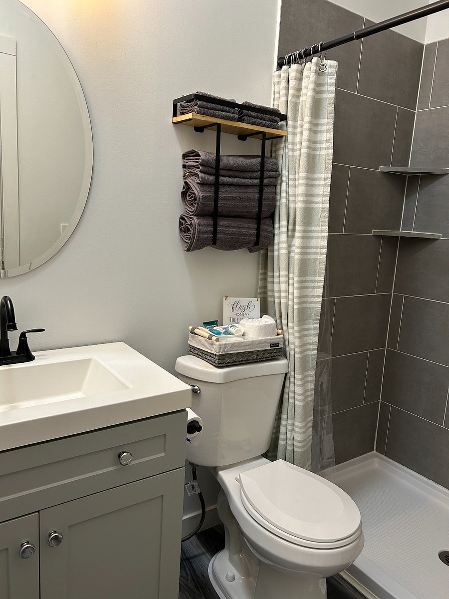 Private bathroom, complete with towels, washcloths and basket of complimentary essentials
