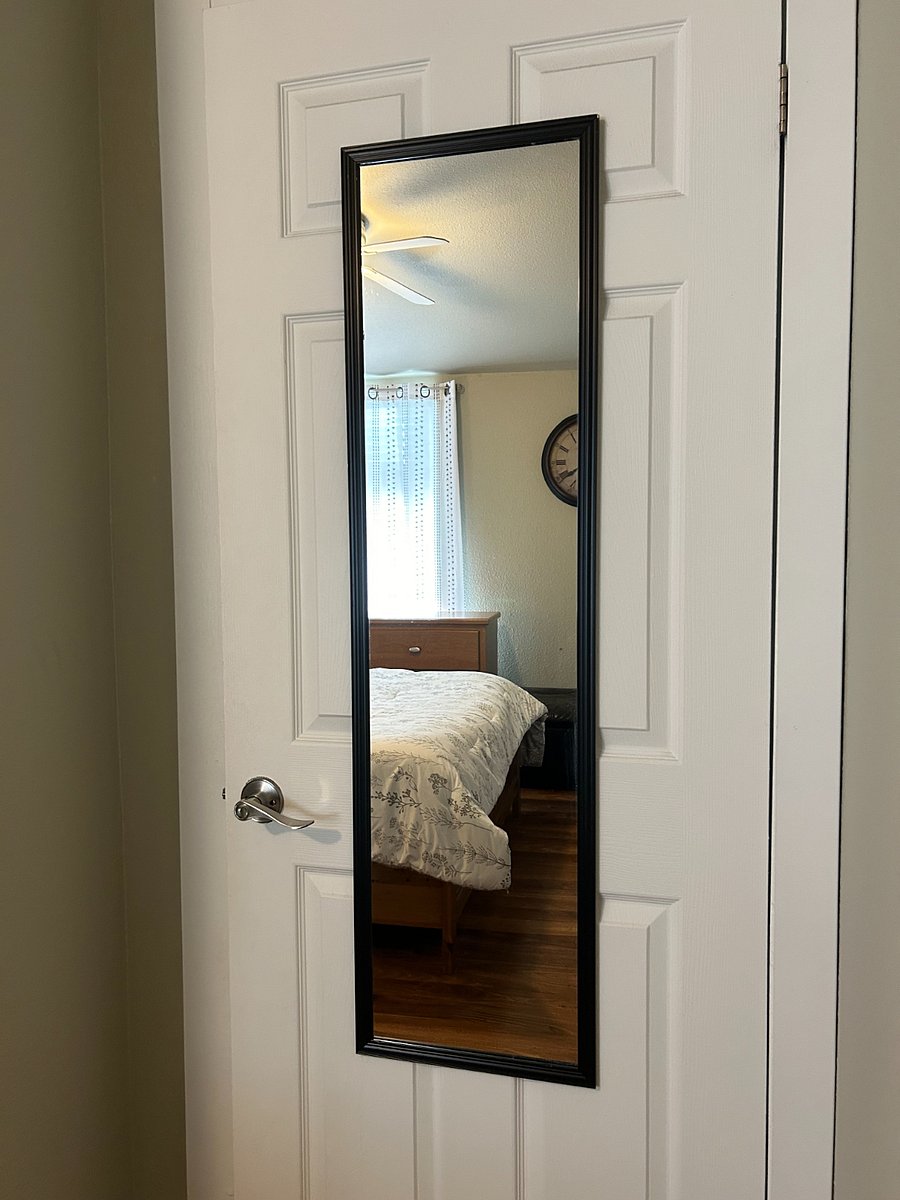 Full length mirror on the back of the bedroom door