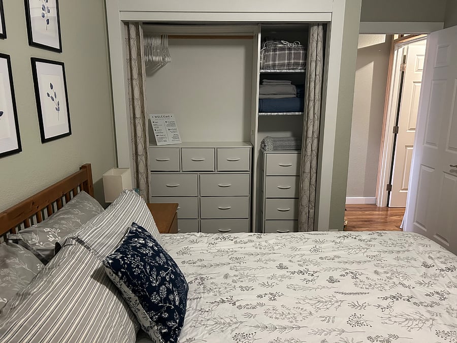 View of closet, bedroom door and hallway with hallway door to the rest of the house