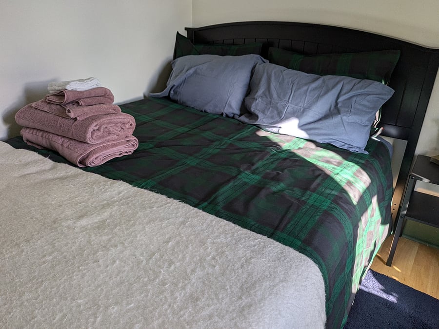 Full bed with amazing window light.