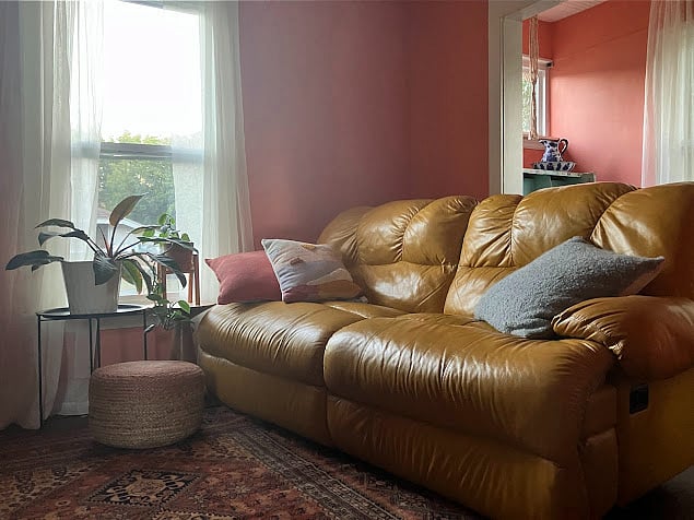 Our leather sofa reclines fully on both sides.