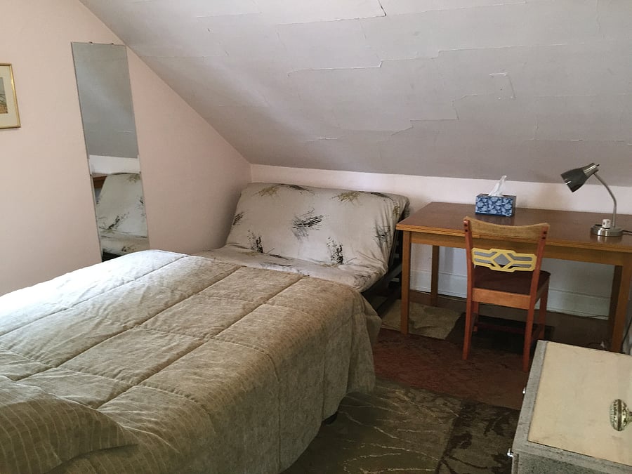 Bedroom with desk and closet
