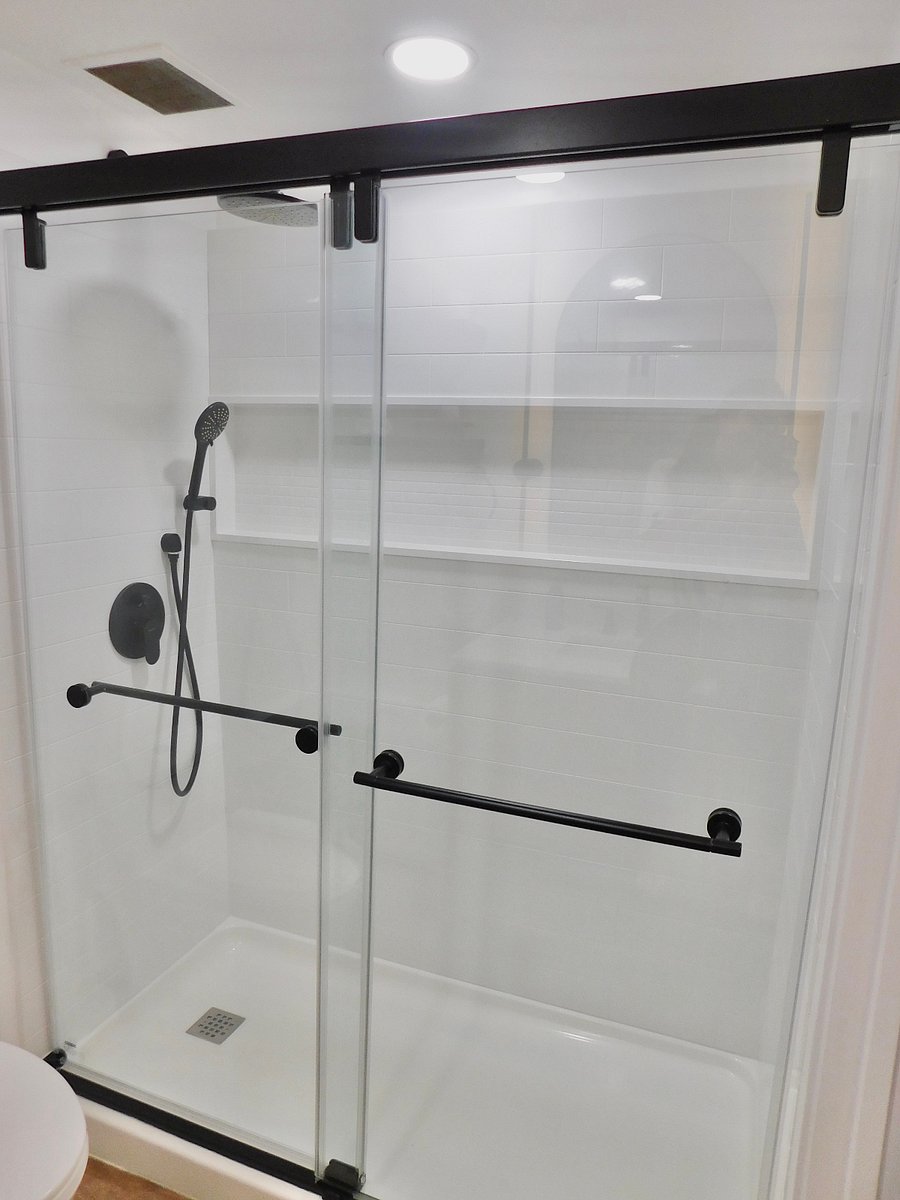 Large shower equipped with rainfall showerhead and hand-held combo. Store all of your essentials in our spacious storage niche!