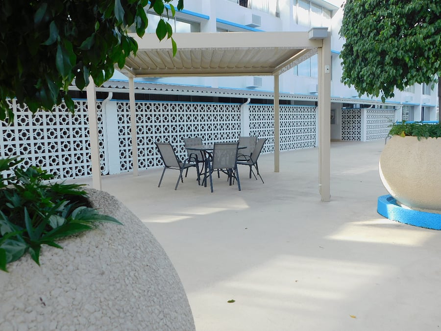 There are 2 pergolas with ample seating on the pool deck