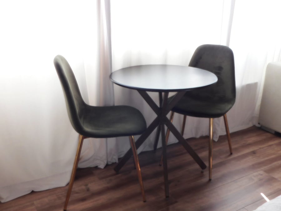 Bistro table for two for dining. Workspace desk available upon request (not pictured)