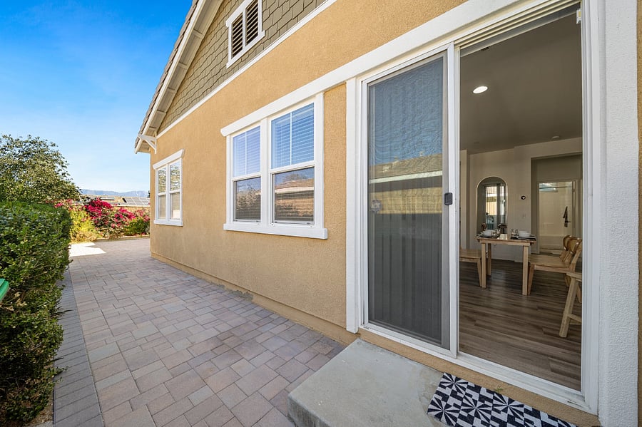 Sliding glass door from living area to backyard.