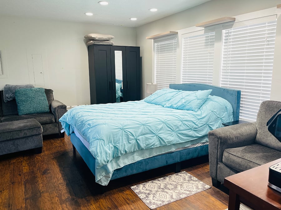 Queen size bed with protective casing for mattress and pillows