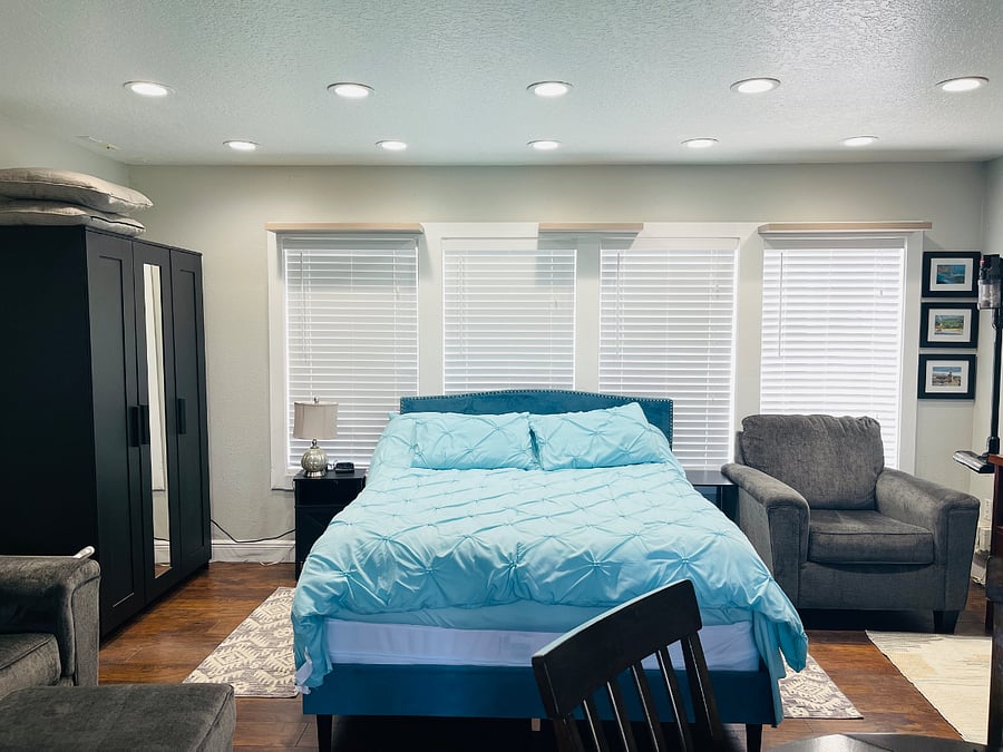 Queen size bed with protective casing for mattress and pillows