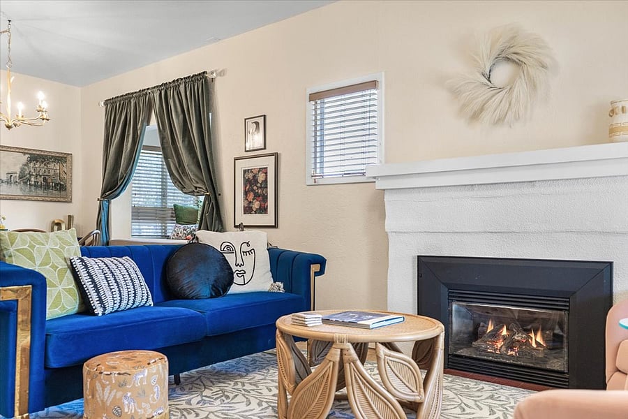 Stay cozy with this velvet couch and gas fireplace, who needs to go out for a good time, stay in!