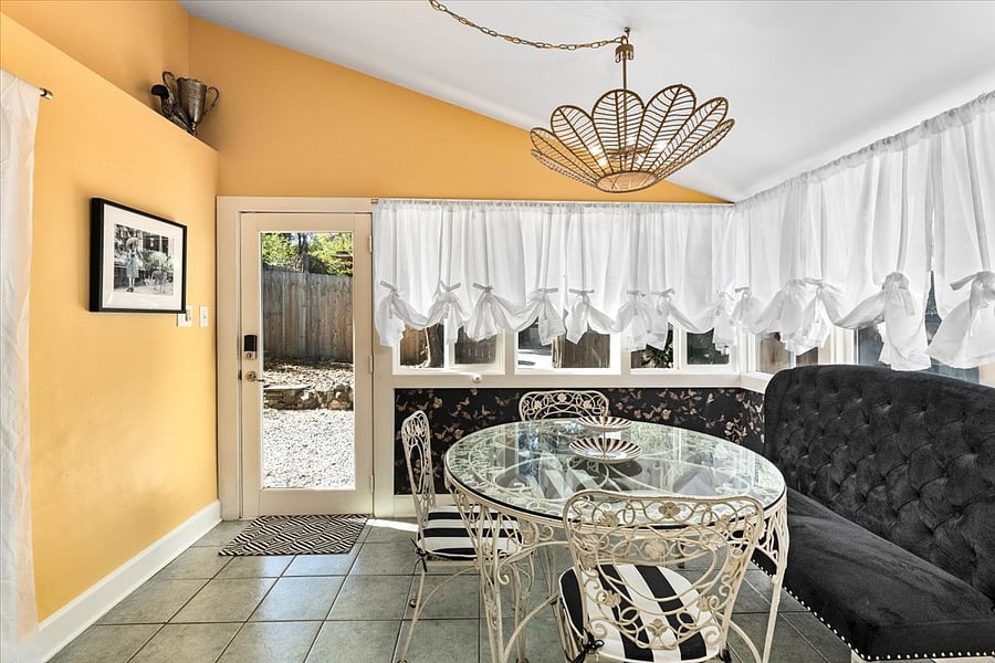 Enjoy a cup of coffee or tea, or host a friend for cocktails, this sunroom is the perfect spot for entertaining come rain or shine.