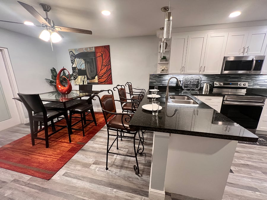 counter top kitchen with stools dining area