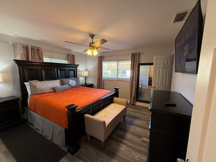 king bed primary bedroom with ensuite  bathroom with rain down walk in shower