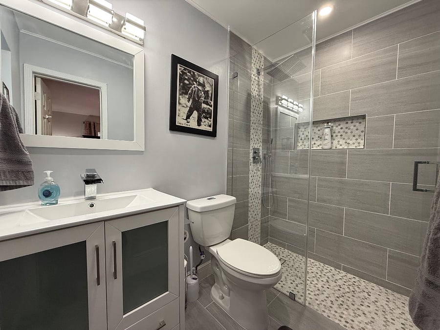 primary bathroom with rain down walk in shower