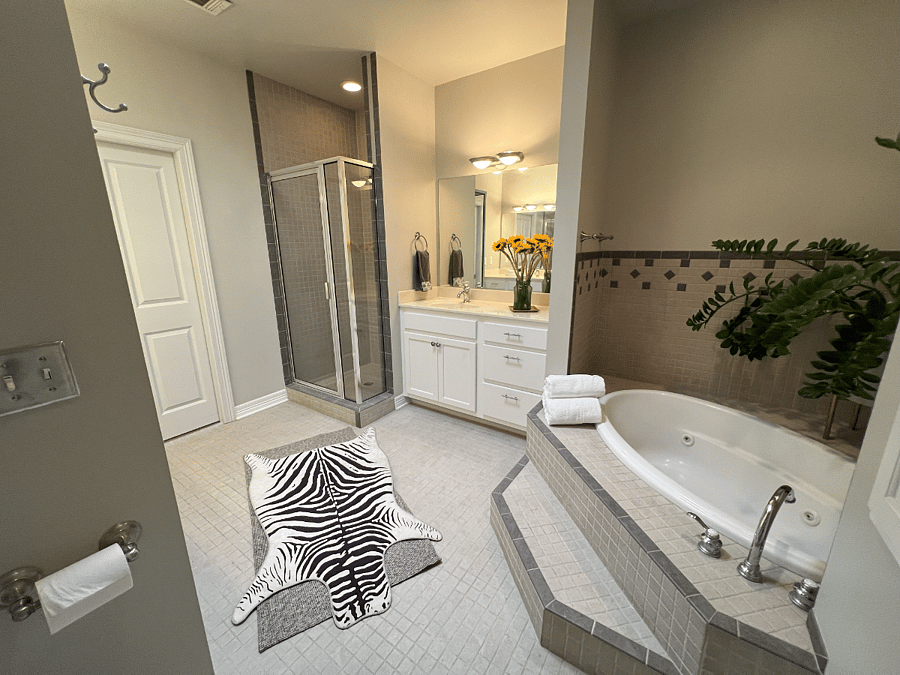 Main bathroom with separate tub and shower.