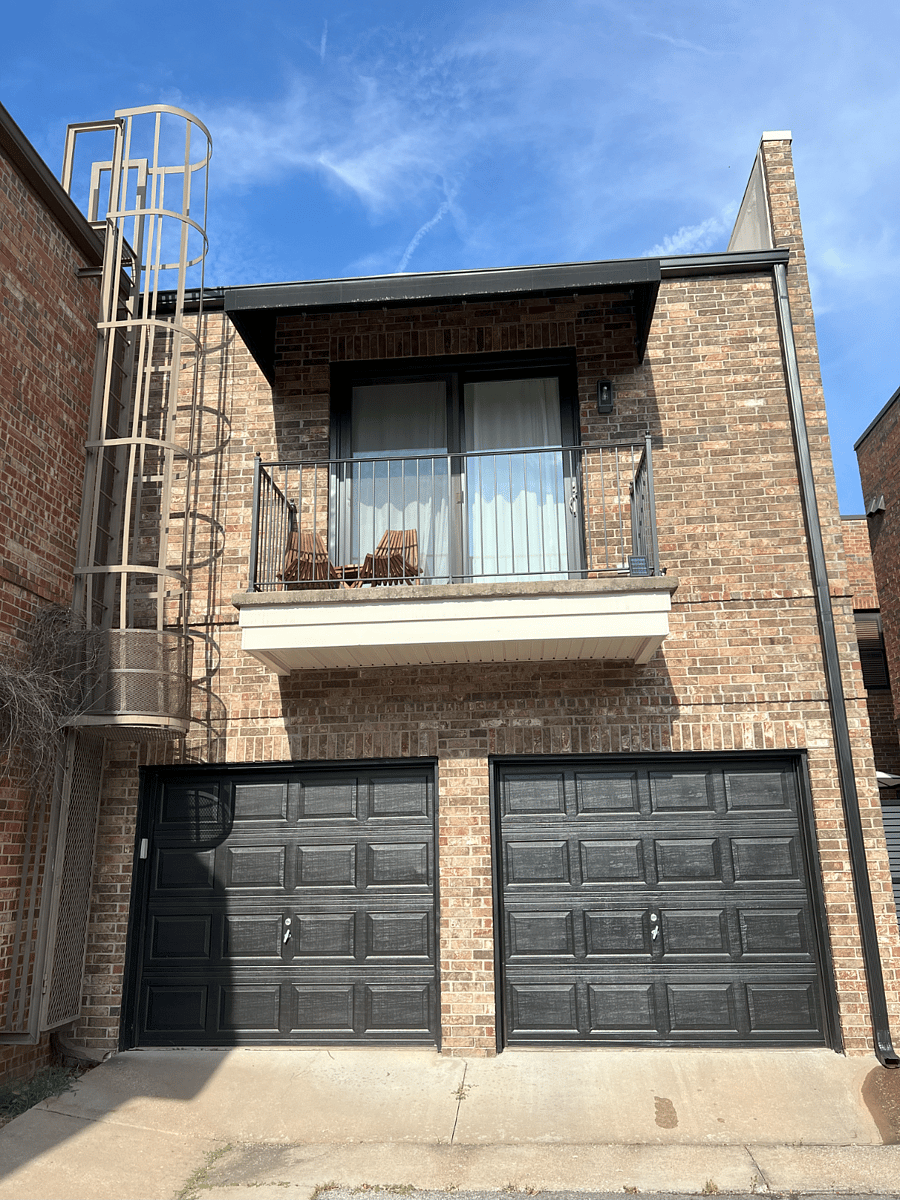 Garage entrance and balcony off main bedroom.