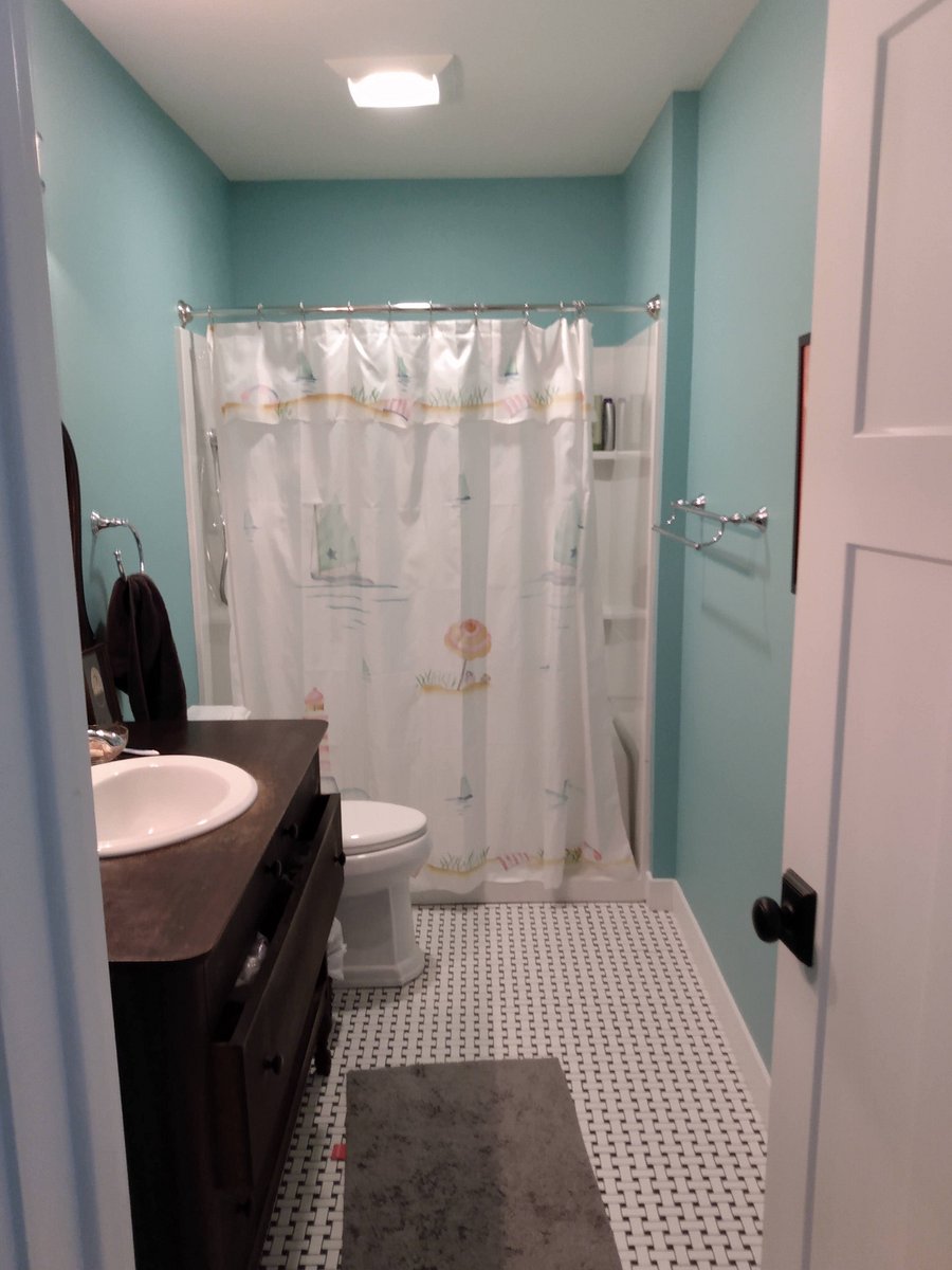 En suite bath on primary bedroom. Soaker tub and shower.