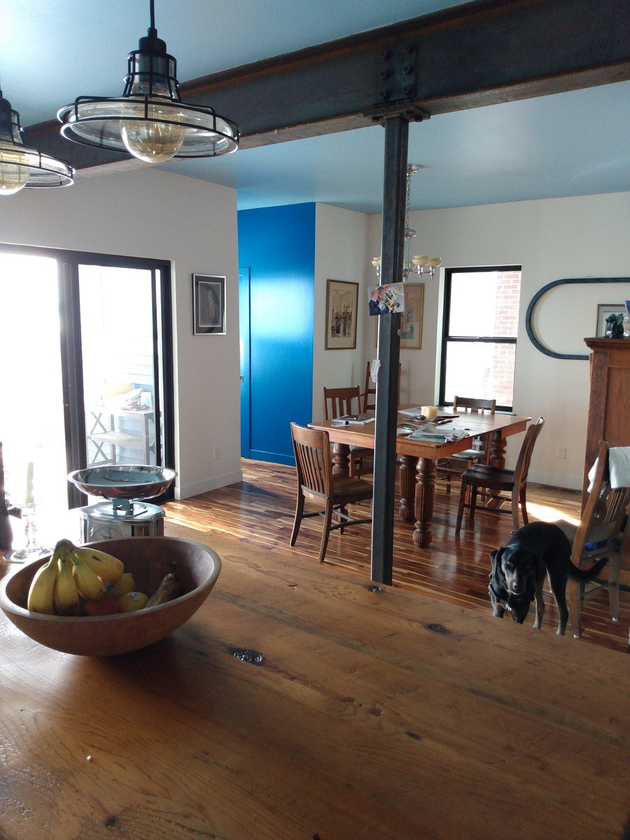 Open plan first floor includes kitchen, dining, living room, powder room, and, of course, windows to the lake view.