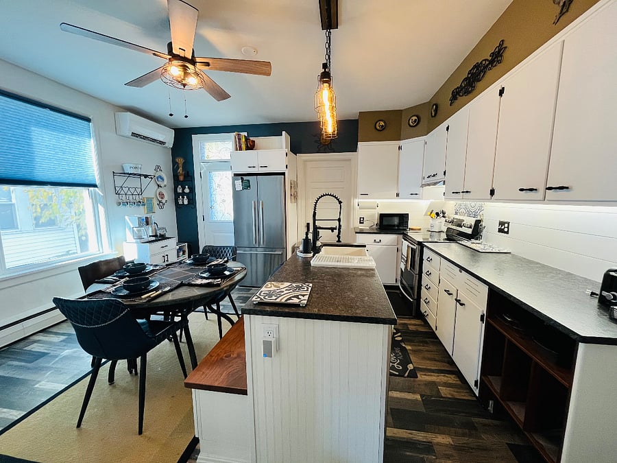 Fully outfitted kitchen - 1/2 bath is through the door next to fridge.