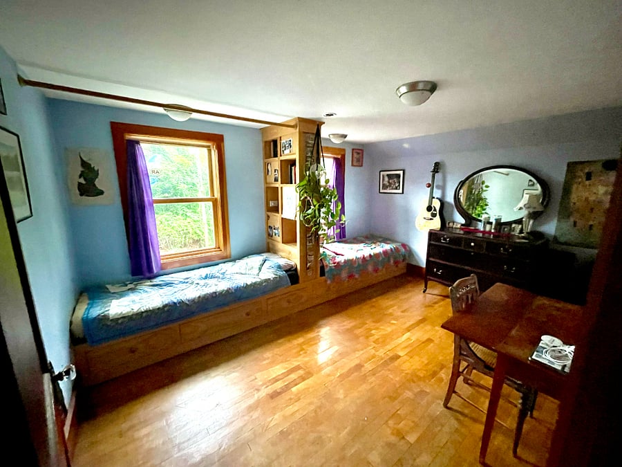 Second bedroom with 2 built-in, single beds and fold-out queen mattress.