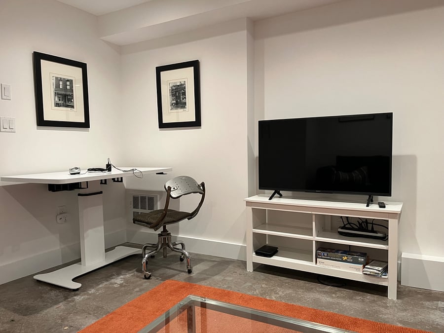 Adjustable height desk, Smart TV
