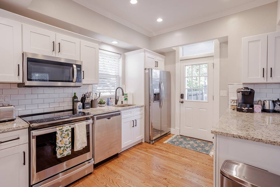 Kitchen -- NTwo ew appliances with induction stove