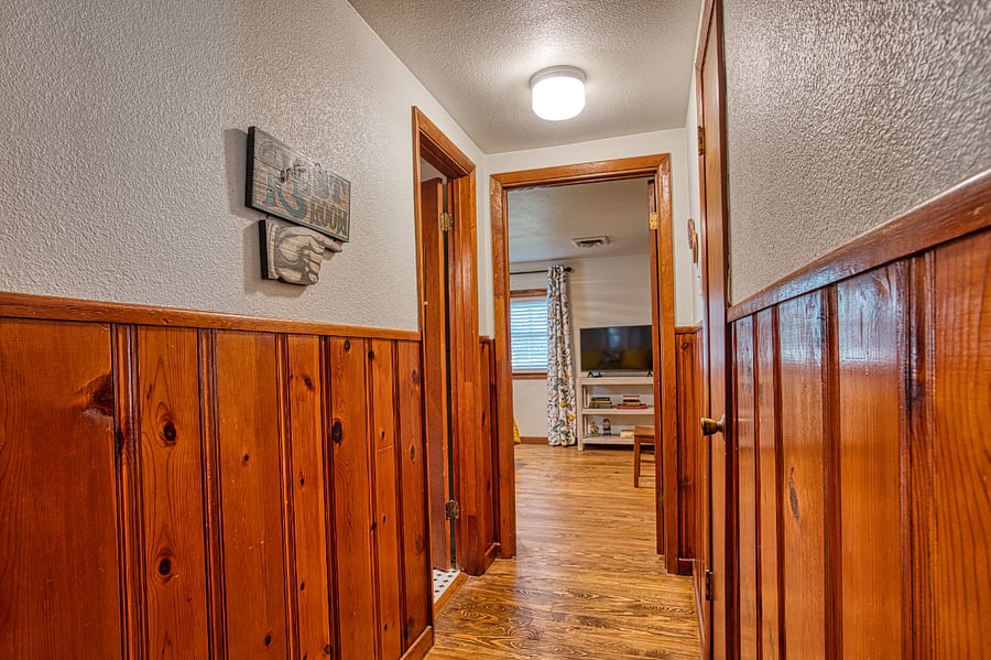 Hallway with 3rd bath and view of 3rd bedroom