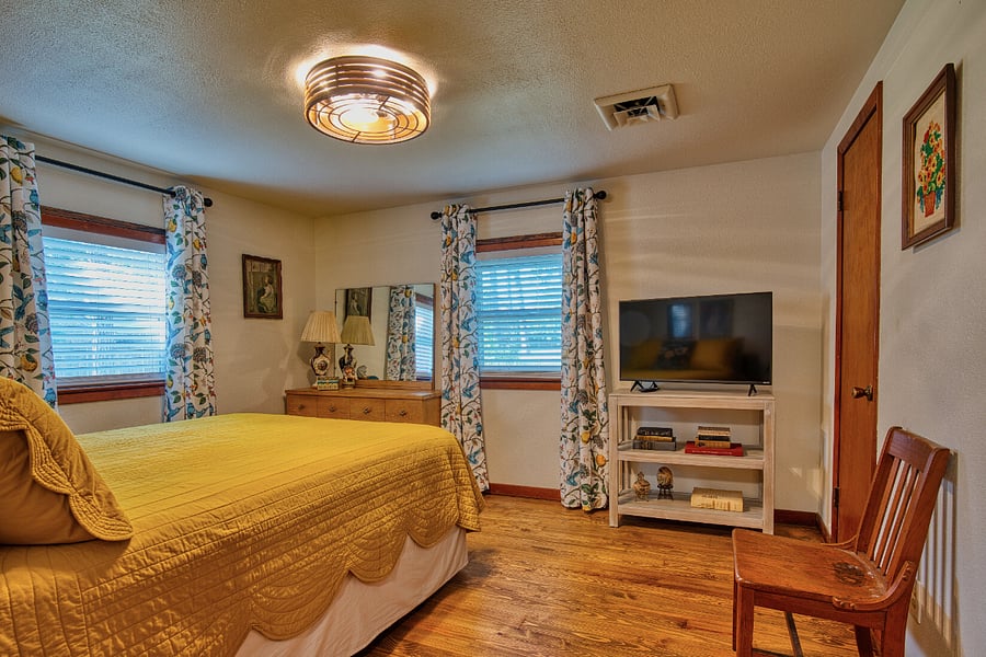 3rd bedroom with queen size bed, two closets and smart tv.