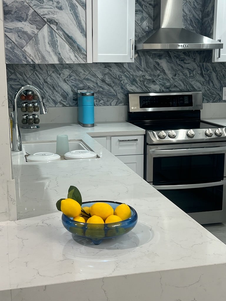 A minor waterfall countertop keeps you always within sight of living room activities. Small appliances include a Keurig coffeemaker, 4 slot sliced bread/bagel toaster, waffle maker, and more.