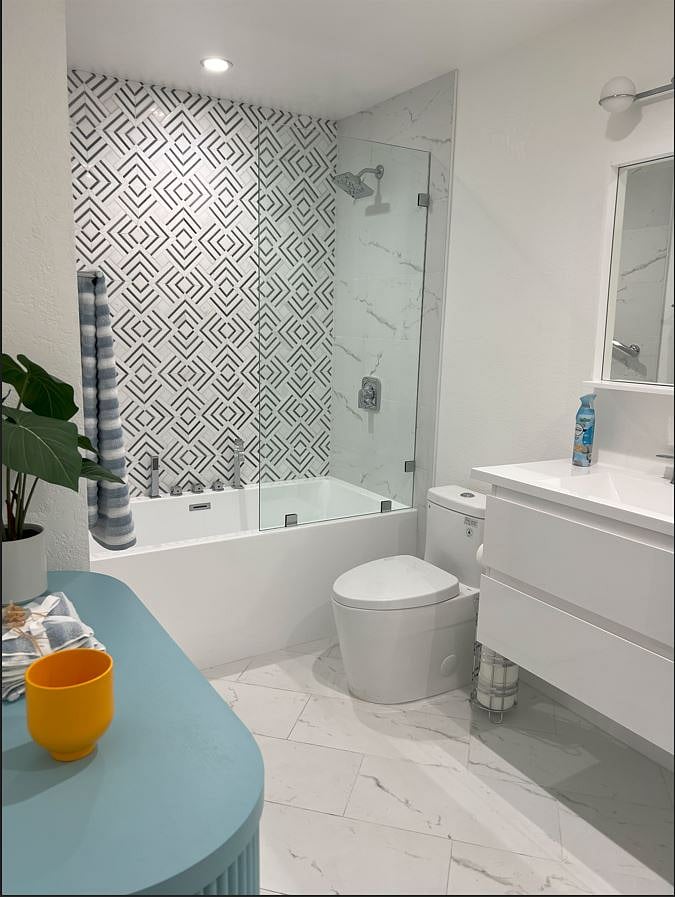 The primary bathroom is the size of small bedroom.  It's spa like features entise you to linger as you bathe.  The tub is grandsize well-suited for tall or big people. Though kids may play, this special place is actually meant for your enjoyment and entertainment.