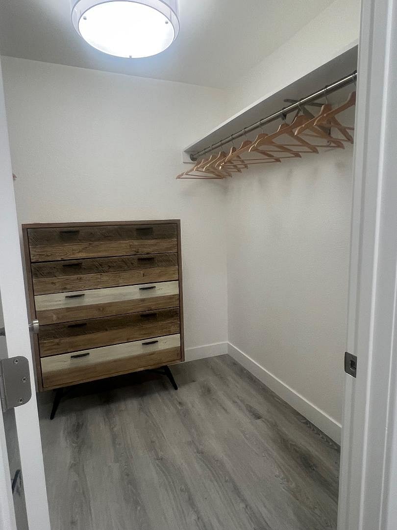 The principal bedroom has a large walk-in closet that easily accommodates luggage, clothing and more as well as a second standard closet. There is more space than you can possibly imagine.