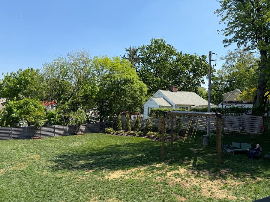 View of part of back yard where dogs sniff, play, relax.  Yard is fully fenced, Dog waste stations are available for all to use