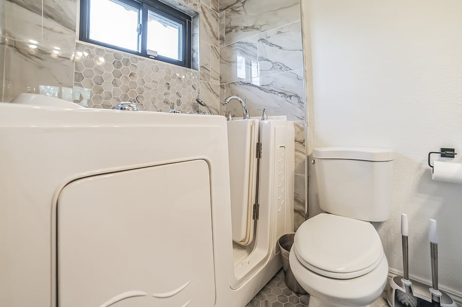 Main house bathroom with walk in tub