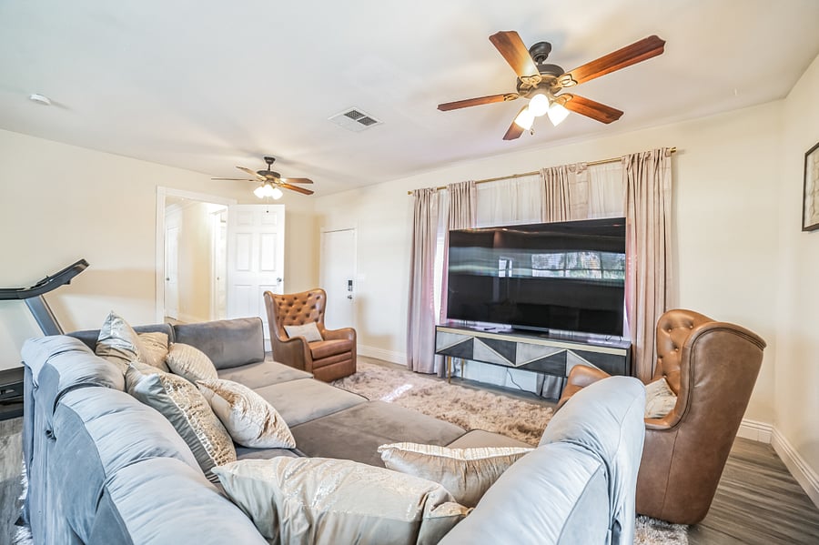 Main house recreation room with 85" OLED TV, Play Station 5, and two Meta Oculus Virtual Reality systems
