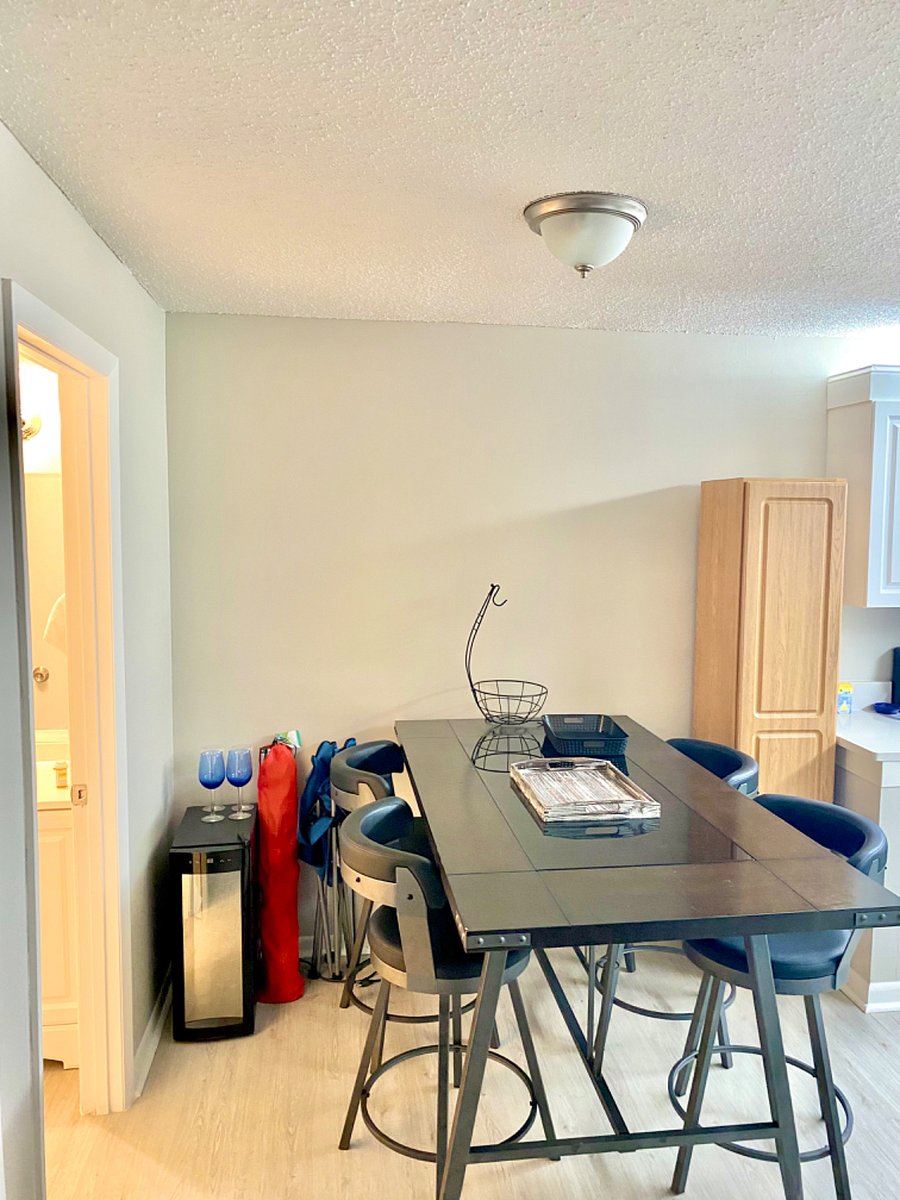 4 chairs and dining table. Wine fridge
