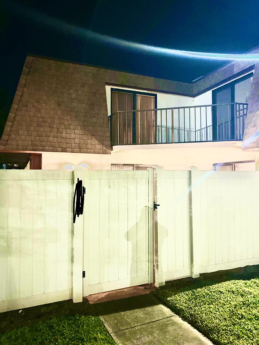 Upstairs large balcony with sliding glass door.