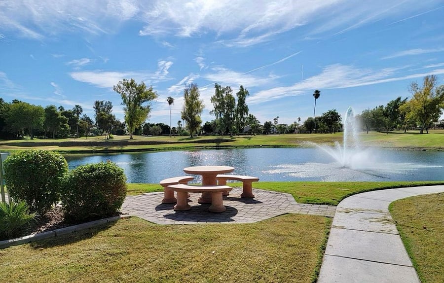 Community walkway overlooking pond and golf course