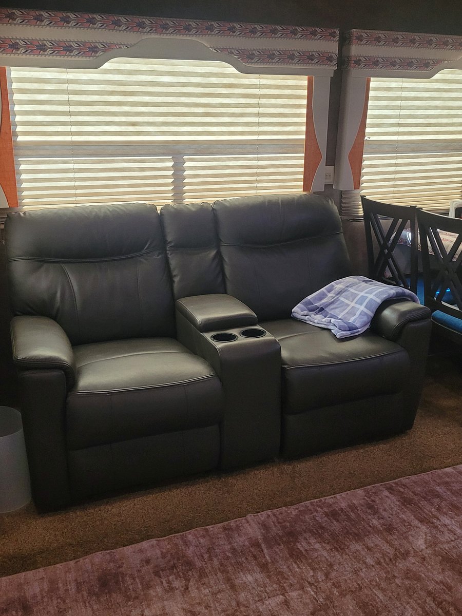 Recliners with cup holders and lift up console.