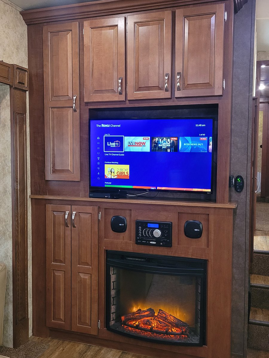 Smart TV with Roku, electric fireplace, DVD player, lots of cabinet storage