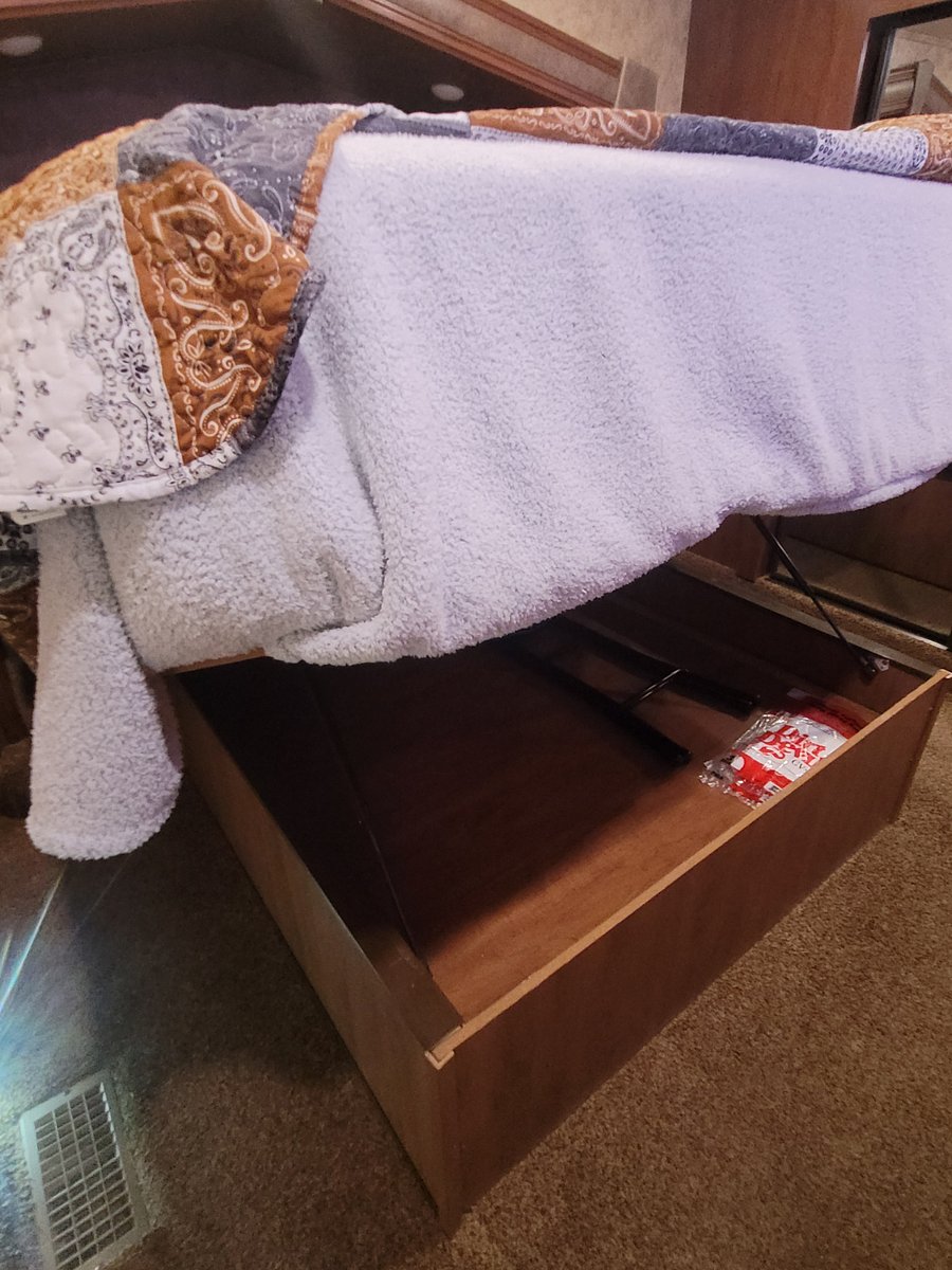 The bed lifts up to provide even more storage. Very easy to lift and to close. Use for the vacuum, etc., or to store whatever you need.