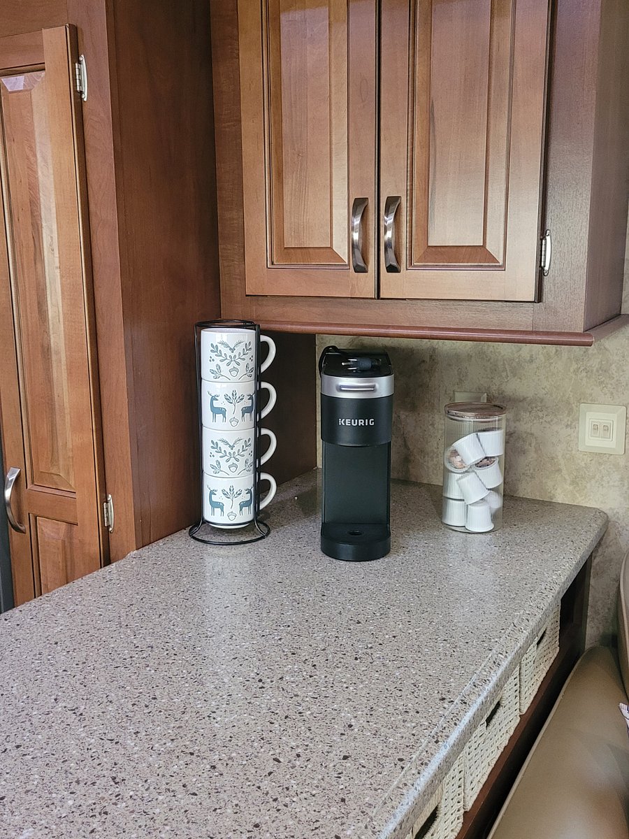 Coffee bar or extra counter space. More cabinets above.