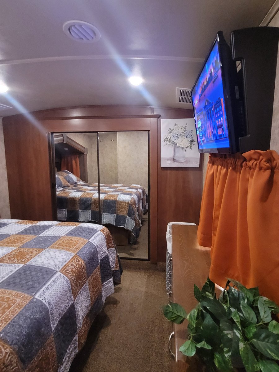 Welcome to the bedroom. Black out curtains, smart tv.