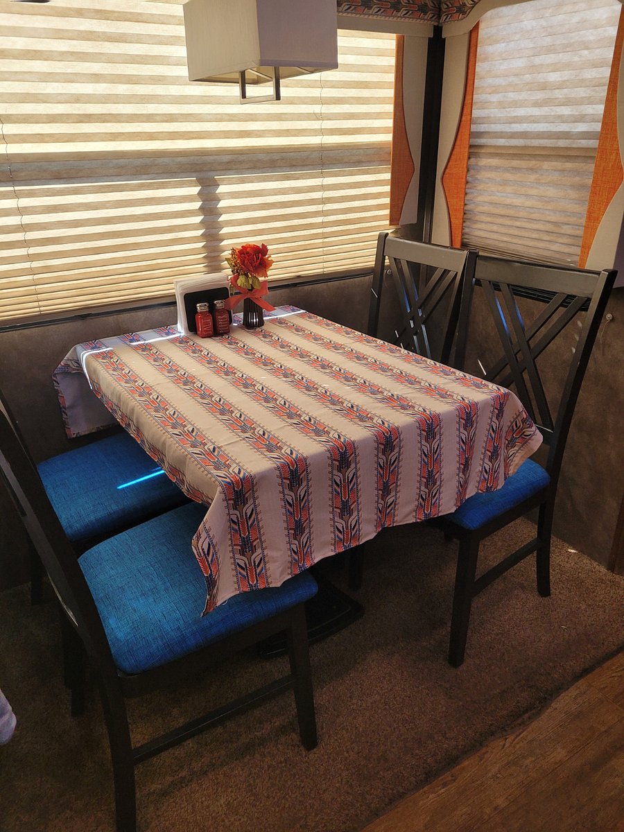 Dinner table, 4 chairs, table cloth, salt & pepper shakers, napkin holder, placemats.