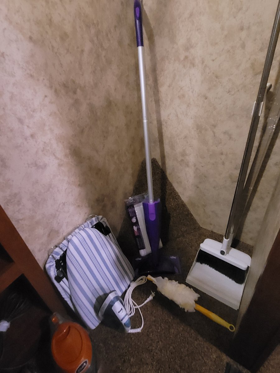 Stick vacuum. Fold out ironing board. Steam iron. Swiffer mop. Broom and dust pan. Swiffer duster.